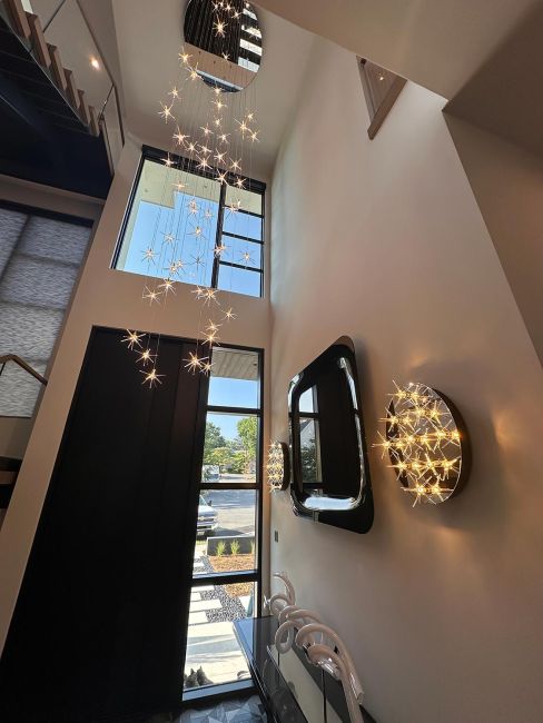 Grand entrance foyer featuring custom cascading starlight pendant light chandelier